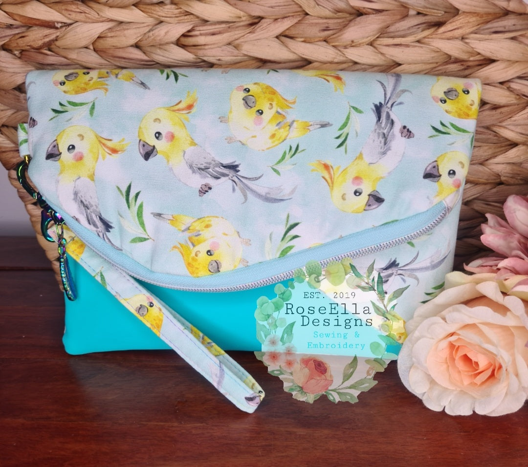 Fold Over Cockatiel Clutch Bag With Vinyl Accents & Removable Matching Wrist Strap