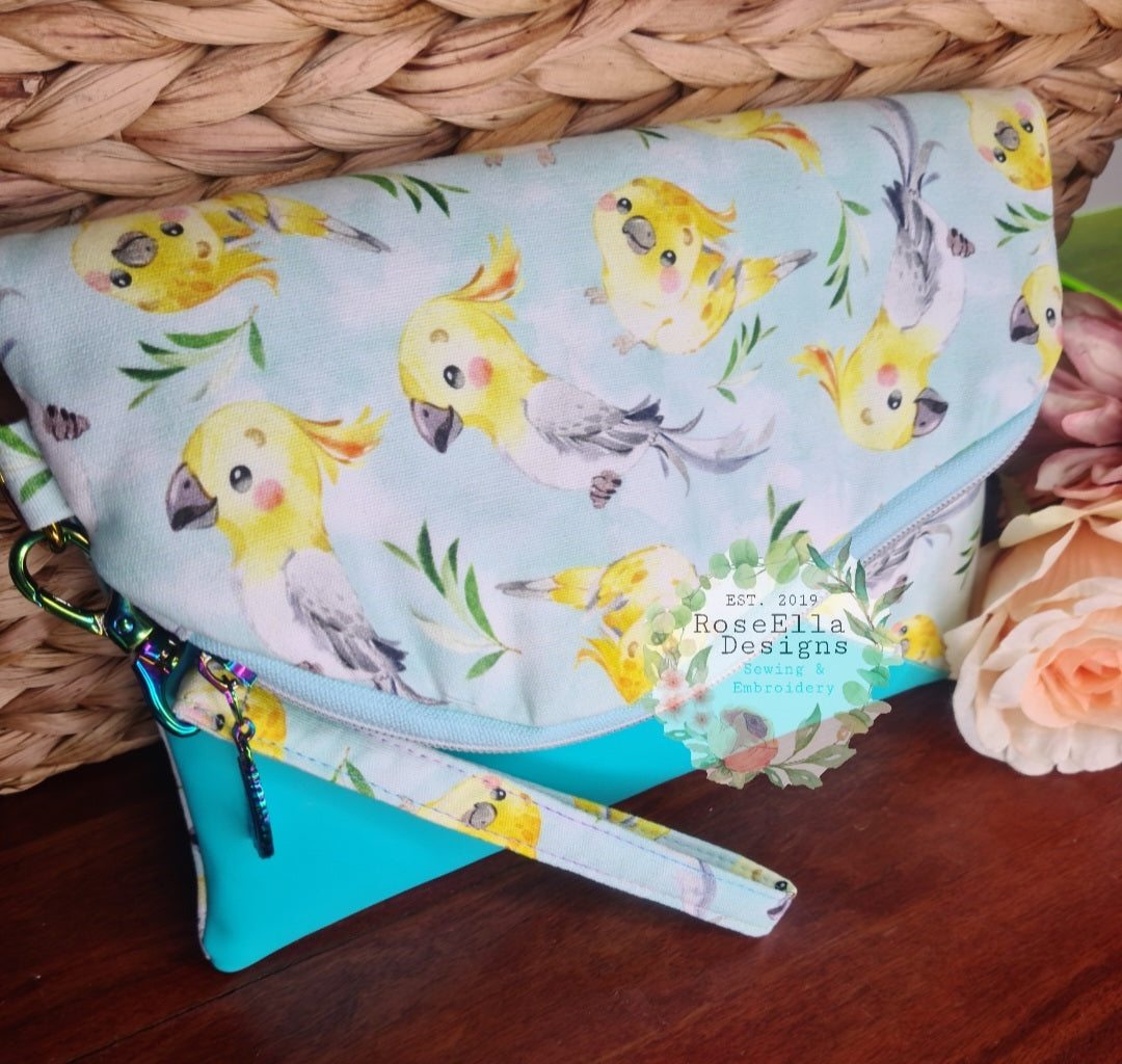 Fold Over Cockatiel Clutch Bag With Vinyl Accents & Removable Matching Wrist Strap