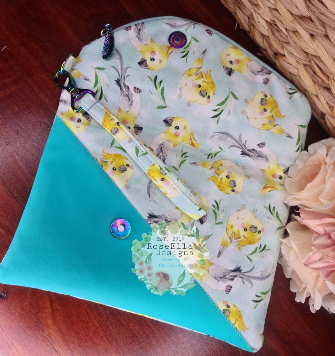 Fold Over Cockatiel Clutch Bag With Vinyl Accents & Removable Matching Wrist Strap